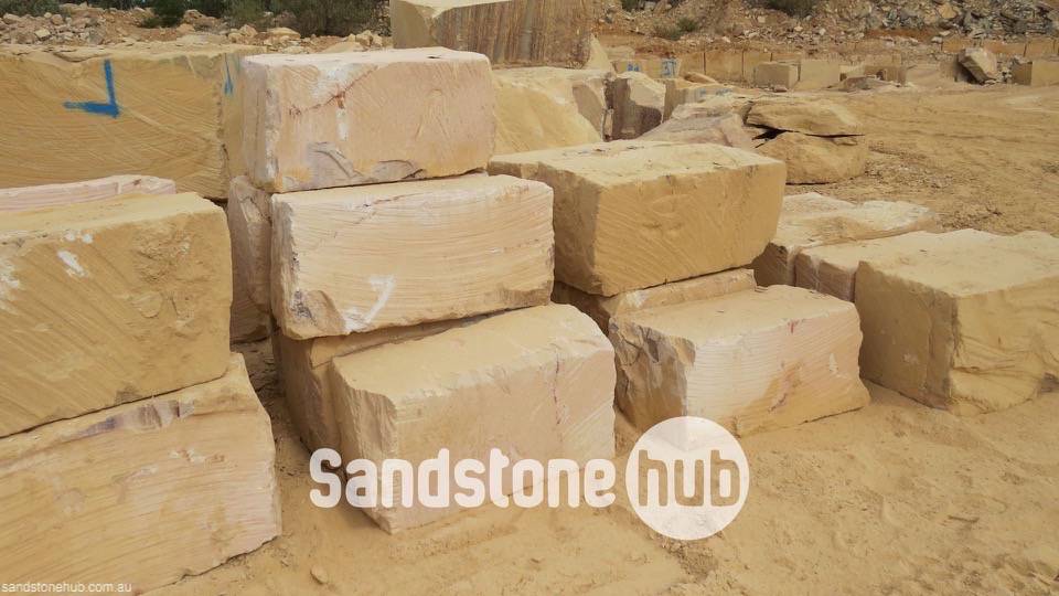 Sandstone BGrade Blocks and Logs Stacked In Quarry