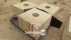 Sandstone Square blocks Diamond cut with hole in the middle on pallet yellow stripe