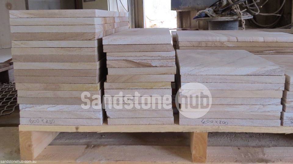 Sandstone Diamond Sawn Tiles, Pavers and Slabs Stacked on Pallets